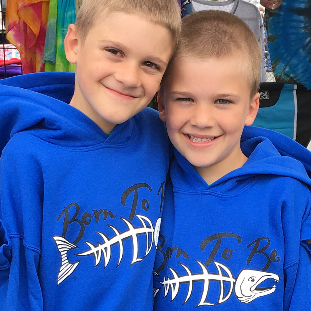 Young kids wearing Born To Be Wild TM salmon design hoodies.